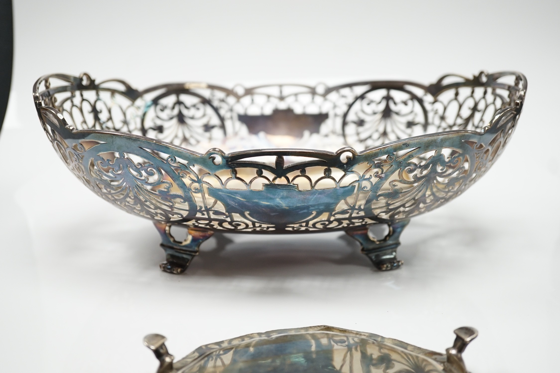 An Elizabeth II pierced silver oval fruit bowl, Poston Products Ltd, Sheffield, 1955, 28.6cm, together with a late Victorian silver waiter, London, 1898, 28.1oz.